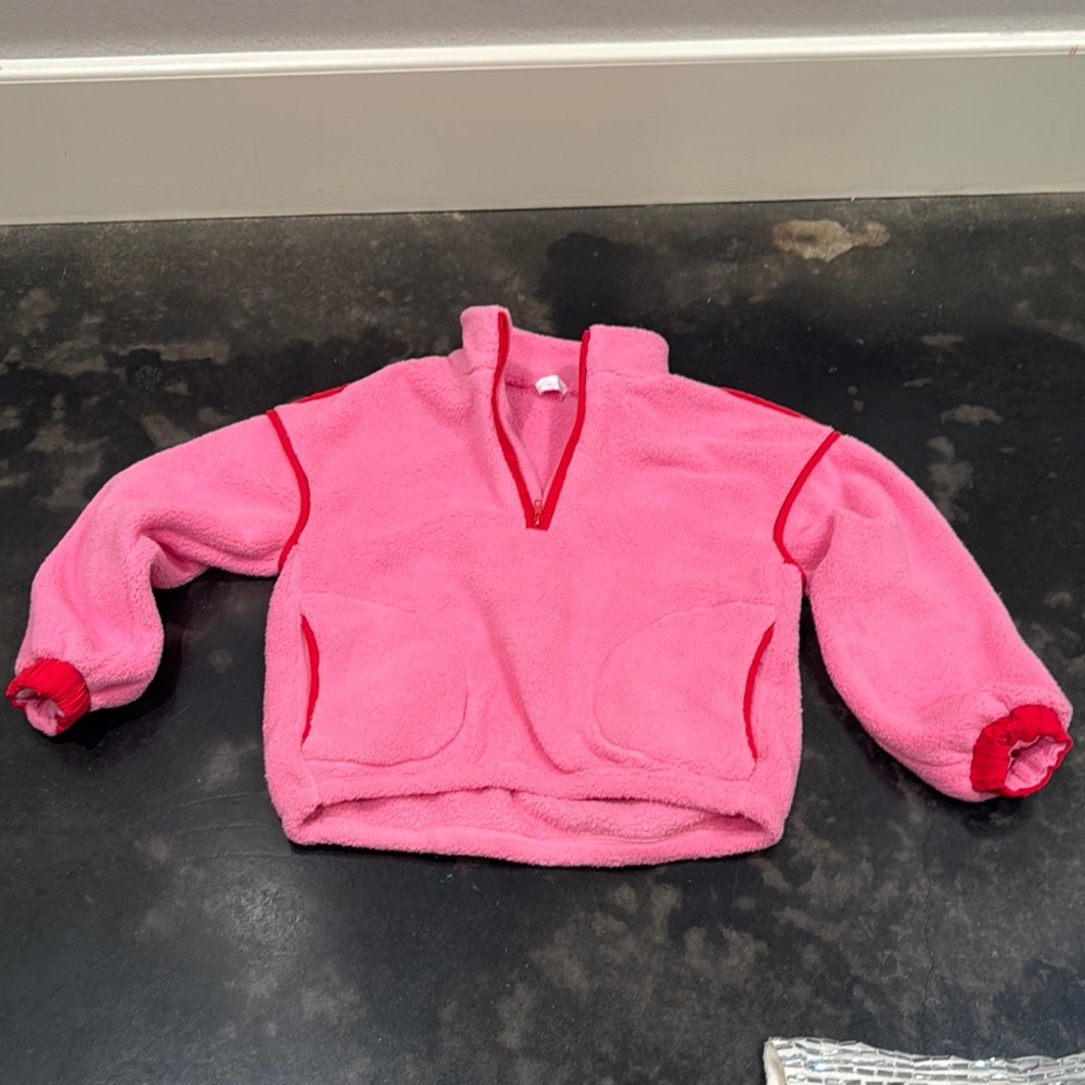 Pink lily Fleece Pullover with Red Accents new never worn.